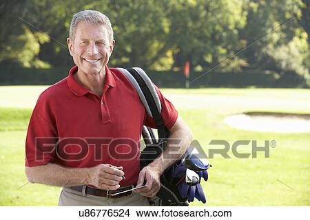Senior man on golf course View Large Photo Image Picture - Senior man on golf course. Fotosearch
