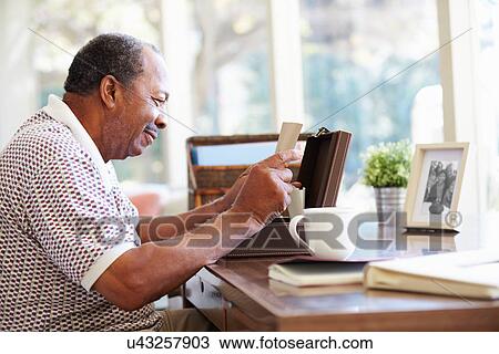 Senior Man Putting Letter Into Keepsake Box View Large Photo Image Stock Image - Senior Man Putting Letter Into Keepsake Box. Fotosearch