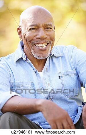 Senior Man Relaxing In Autumn Landscape View Large Photo Image Stock Image - Senior Man Relaxing In Autumn Landscape. Fotosearch