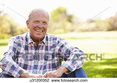 Senior Man Relaxing In Autumn Landscape View Large Photo Image Stock Image - Senior Man Relaxing In Autumn Landscape. Fotosearch
