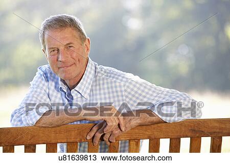 Senior man sitting outdoors View Large Photo Image Stock Image - Senior man sitting outdoors. Fotosearch