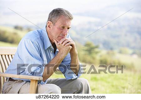Senior man sitting outdoors View Large Photo Image Stock Image - Senior man sitting outdoors. Fotosearch