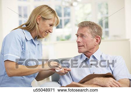 Senior man visited at home by nurse View Large Photo Image Stock Image - Senior man visited at home by nurse. Fotosearch