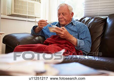 Senior Man With Poor Diet Keeping Warm Under Blanket View Large Photo Image Stock Photo - Senior Man With Poor Diet Keeping Warm Under Blanket . Fotosearch