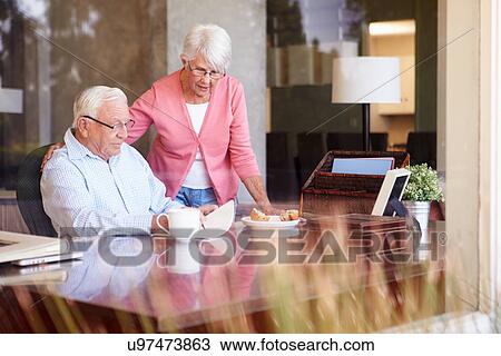 Senior Man Writing Memoirs In Book Sitting At Desk View Large Photo Image Stock Image - Senior Man Writing Memoirs In Book Sitting At Desk. Fotosearch