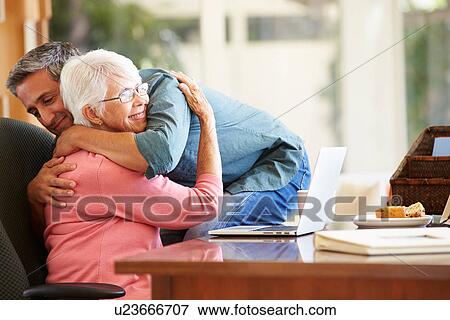 Senior Mother Being Comforted By Adult Son View Large Photo Image Stock Photo - Senior Mother Being Comforted By Adult Son. Fotosearch