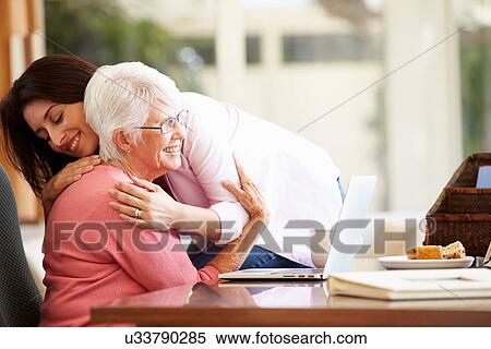 Senior Mother Being Comforted By Adult Daughter View Large Photo Image Stock Photography - Senior Mother Being Comforted By Adult Daughter. Fotosearch