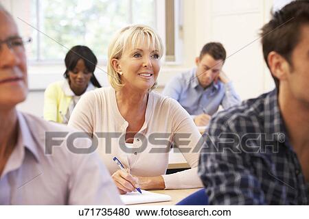 Stock Image - Senior student in class. Fotosearch