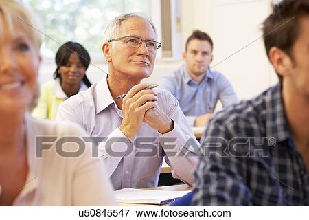 Senior student in class View Large Photo Image Stock Photo - Senior student in class. Fotosearch