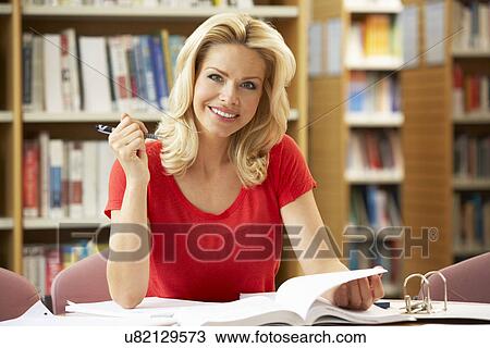 Senior student working in library View Large Photo Image Stock Image - Senior student working in library. Fotosearch