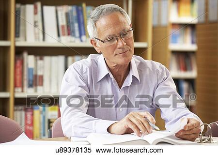 Senior student working in library View Large Photo Image Stock Photography - Senior student working in library. Fotosearch