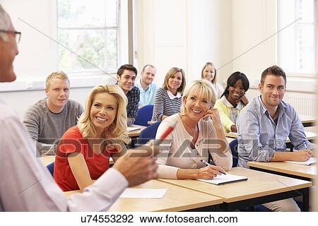 Senior tutor teaching class View Large Photo Image Stock Image - Senior tutor teaching class. Fotosearch
