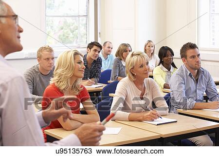 Senior tutor teaching class View Large Photo Image Stock Image - Senior tutor teaching class. Fotosearch