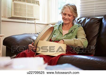 Senior Woman Keeping Warm Under Blanket With Memory Box View Large Photo Image Stock Photography - Senior Woman Keeping Warm Under Blanket With Memory Box. Fotosearch