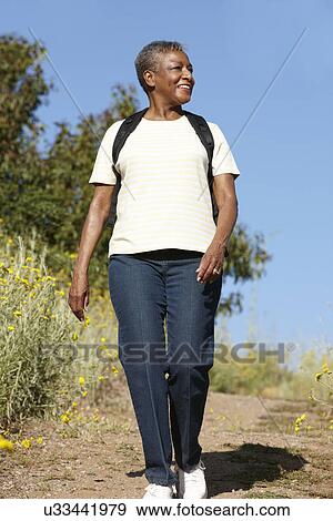 Senior woman on country hike View Large Photo Image Stock Photo - Senior woman on country hike. Fotosearch