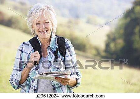 Senior woman on country walk View Large Photo Image Picture - Senior woman on country walk. Fotosearch