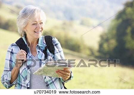 Senior woman on country walk View Large Photo Image Stock Photo - Senior woman on country walk. Fotosearch