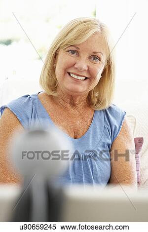 Senior woman using skype View Large Photo Image Stock Photography - Senior woman using skype. Fotosearch
