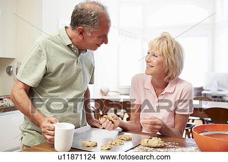 Senior Woman With Husband Baking Cookies In Kitchen View Large Photo Image Picture - Senior Woman With Husband Baking Cookies In Kitchen. Fotosearch