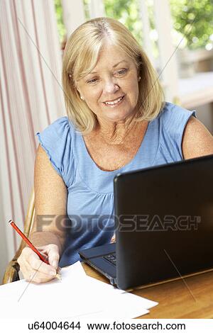Senior Woman Working In Home Office View Large Photo Image Picture - Senior Woman Working In Home Office. Fotosearch