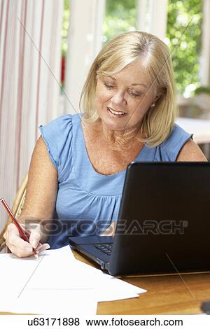 Senior Woman Working In Home Office View Large Photo Image Stock Photo - Senior Woman Working In Home Office. Fotosearch