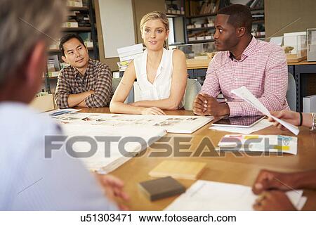 Six Architects Sitting Around Table Having Meeting View Large Photo Image Stock Image - Six Architects Sitting Around Table Having Meeting. Fotosearch