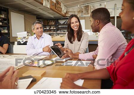 Six Architects Sitting Around Table Having Meeting View Large Photo Image Stock Photography - Six Architects Sitting Around Table Having Meeting. Fotosearch
