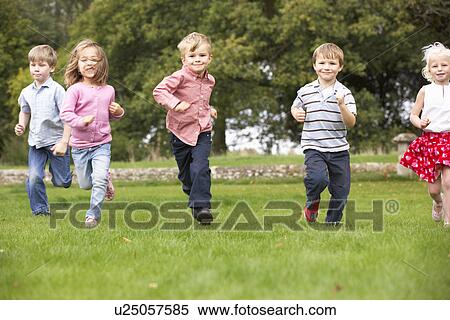 Stock Photography - Small group young children running in park. Fotosearch