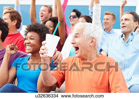 Spectators Cheering At Outdoor Sports Event View Large Photo Image Picture - Spectators Cheering At Outdoor Sports Event. Fotosearch