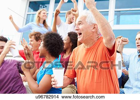 Picture - Spectators Cheering At Outdoor Sports Event. Fotosearch