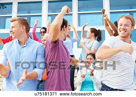 Spectators Cheering At Outdoor Sports Event View Large Photo Image Stock Image - Spectators Cheering At Outdoor Sports Event. Fotosearch