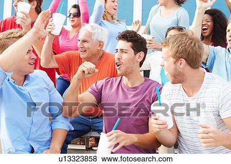 Stock Photo - Spectators Cheering At Outdoor Sports Event. Fotosearch