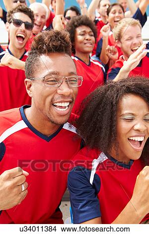 Spectators In Team Colors Watching Sports Event View Large Photo Image Picture - Spectators In Team Colors Watching Sports Event. Fotosearch