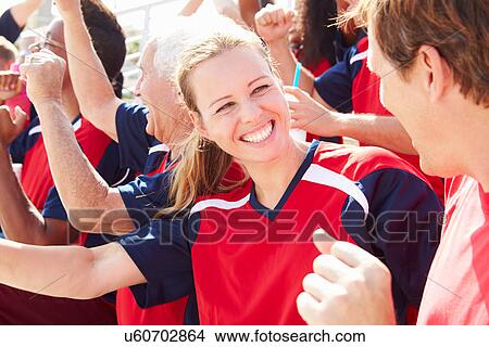 Picture - Spectators In Team Colors Watching Sports Event. Fotosearch
