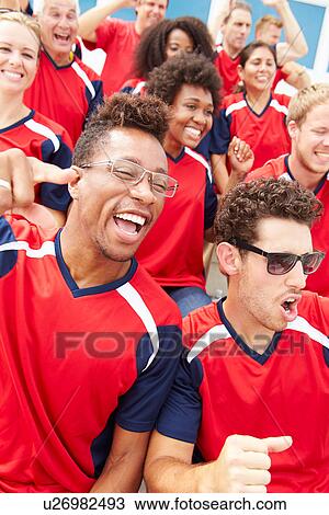 Stock Image - Spectators In Team Colors Watching Sports Event. Fotosearch