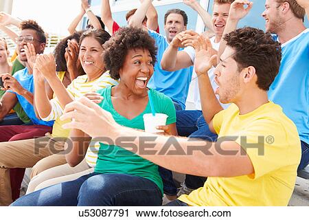 Spectators In Team Colors Watching Sports Event View Large Photo Image Stock Image - Spectators In Team Colors Watching Sports Event. Fotosearch
