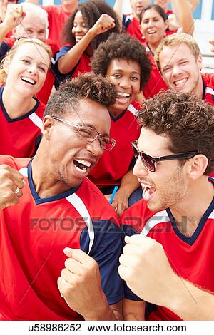 Spectators In Team Colors Watching Sports Event View Large Photo Image Stock Image - Spectators In Team Colors Watching Sports Event. Fotosearch