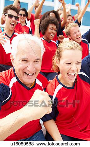Spectators In Team Colors Watching Sports Event View Large Photo Image Stock Photo - Spectators In Team Colors Watching Sports Event. Fotosearch