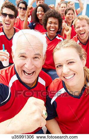 Spectators In Team Colors Watching Sports Event View Large Photo Image Stock Photograph - Spectators In Team Colors Watching Sports Event. Fotosearch