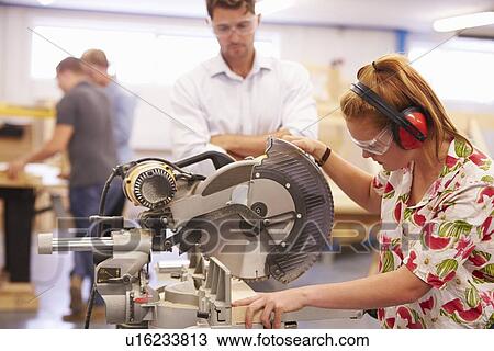 Student And Teacher In Carpentry Class Using Circular Saw View Large Photo Image Stock Image - Student And Teacher In Carpentry Class Using Circular Saw. Fotosearch