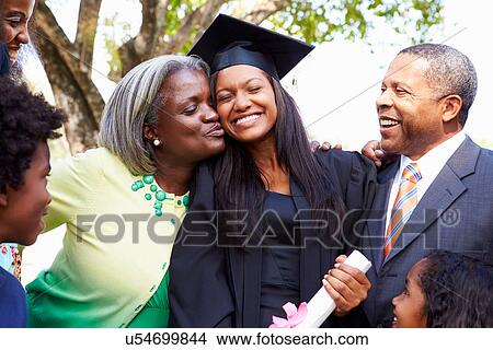 Student Celebrates Graduation With Parents View Large Photo Image Picture - Student Celebrates Graduation With Parents. Fotosearch