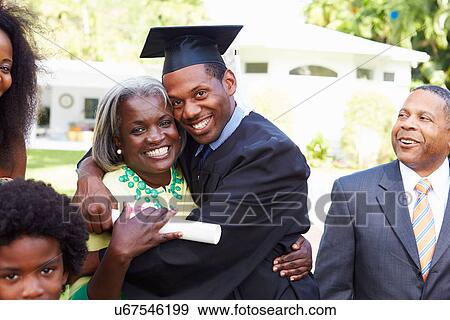 Student Celebrates Graduation With Parents View Large Photo Image Stock Photo - Student Celebrates Graduation With Parents. Fotosearch