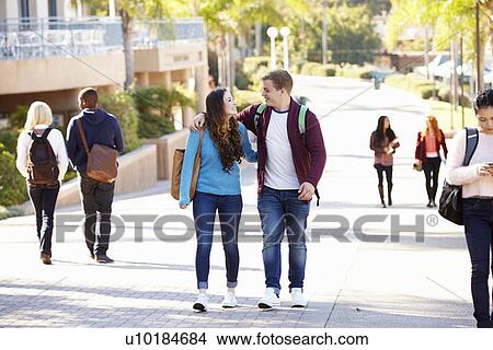 Student Couple Walking Outdoors On University Campus View Large Photo Image Picture - Student Couple Walking Outdoors On University Campus. Fotosearch