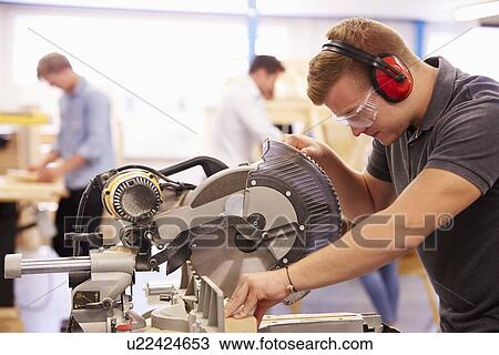 Student In Carpentry Class Using Circular Saw View Large Photo Image Stock Image - Student In Carpentry Class Using Circular Saw. Fotosearch