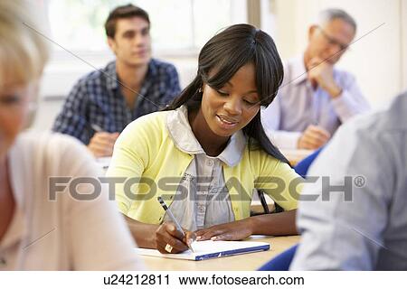 Stock Image - Student in class. Fotosearch