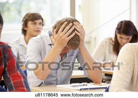 Stock Photography - Student struggling in class. Fotosearch