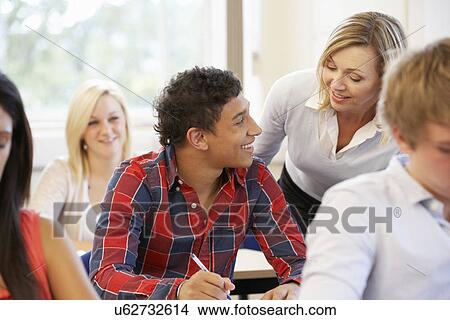 Students and tutor in class View Large Photo Image Picture - Students and tutor in class. Fotosearch