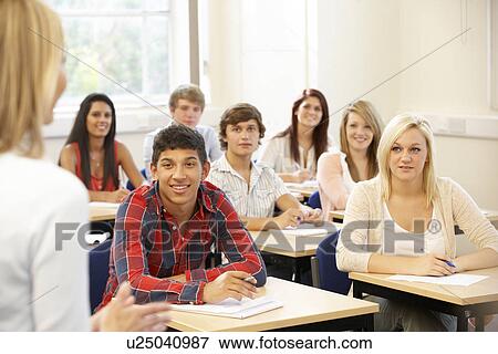 Stock Photo - Students and tutor in class. Fotosearch