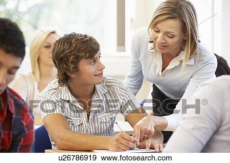 Stock Photo - Students and tutor in class. Fotosearch
