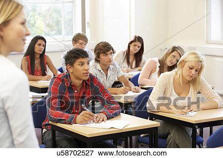 Students and tutor in class View Large Photo Image Stock Photo - Students and tutor in class. Fotosearch
